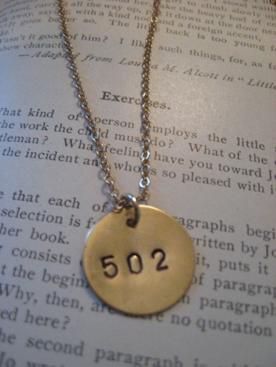 This necklace could serve dual-purposes because the “502″ area code is 